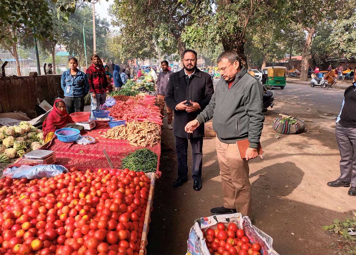 Street vendors made to sit along the Ranbaxy wall in Phase 1